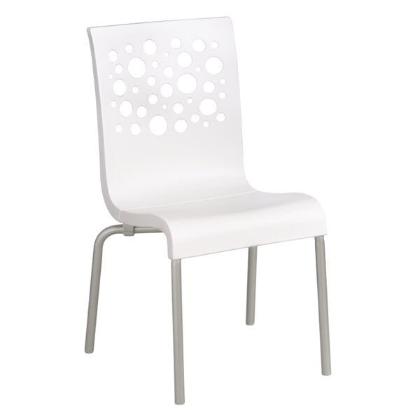 A Grosfillex Tempo white resin chair with holes in the back.