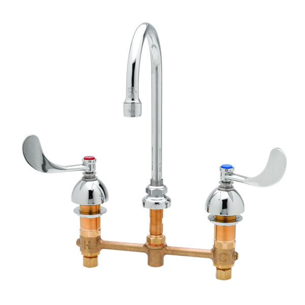 A T&S deck mount faucet with two gooseneck spouts and two wrist action handles.