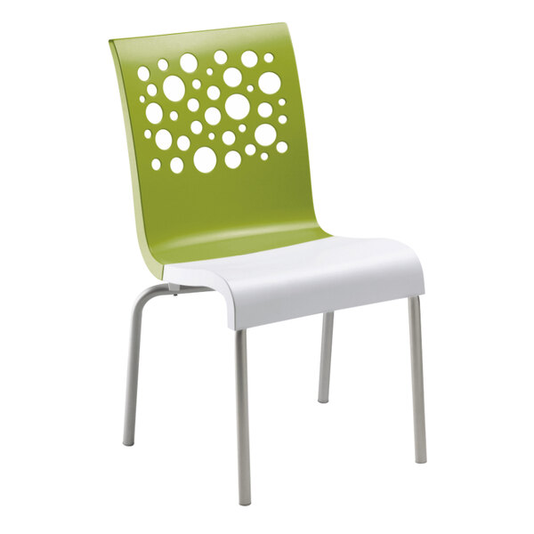 A Grosfillex Tempo stacking chair with a fern green back and white seat on white legs.