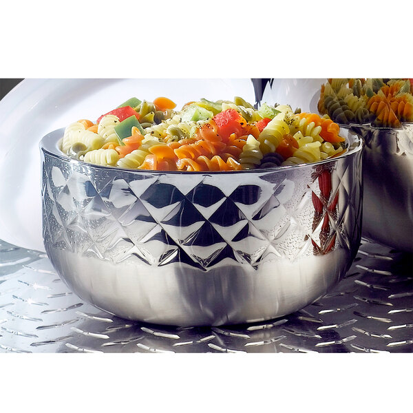 A Bon Chef Diamond Collection triple wall bowl filled with pasta and vegetables on a counter.