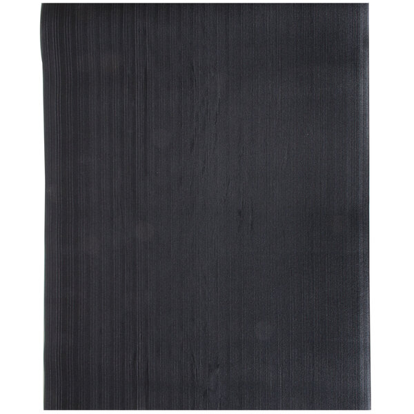 A white rectangular mat with black lines on the surface.