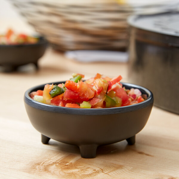 A Carlisle Molcajete Ramekin filled with chopped tomatoes and peppers.