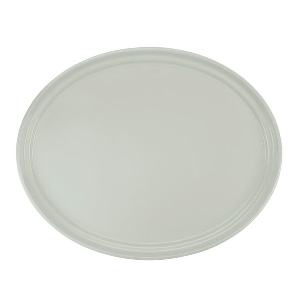 A white Cambro oval fiberglass tray with a white rim.