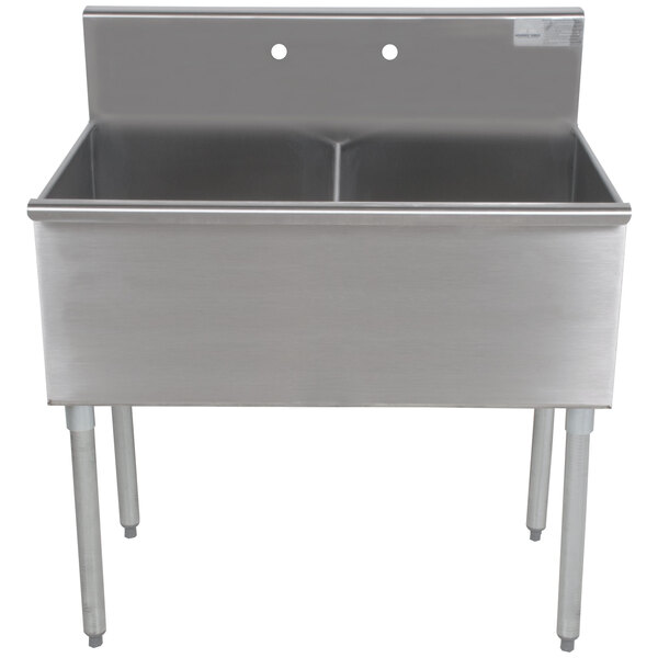 An Advance Tabco stainless steel two compartment sink on a counter.