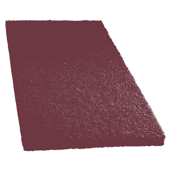 A close-up of a red rectangular Scrubble conditioning pad.