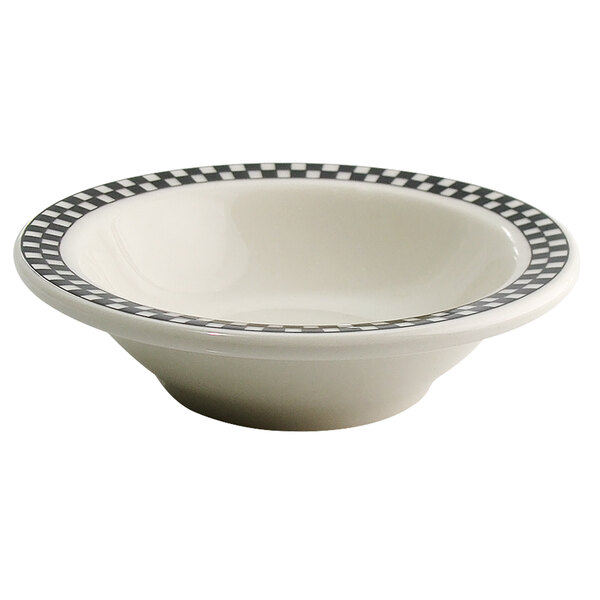 A white bowl with black and white checkered trim.