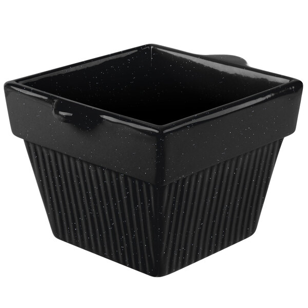 A black square cast aluminum bowl with a lid.