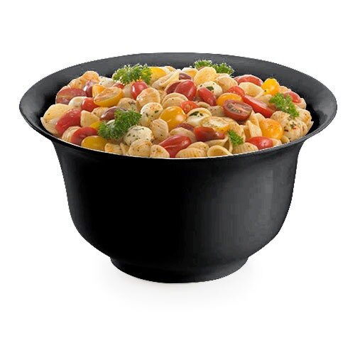 A Tablecraft black cast aluminum tulip salad bowl filled with pasta, tomatoes, and parsley.