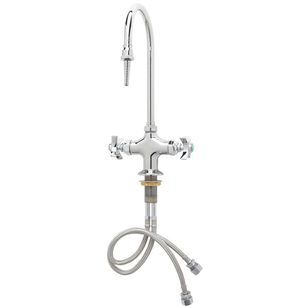 A chrome T&S deck mounted laboratory faucet with flex inlets and a hose attached to it.