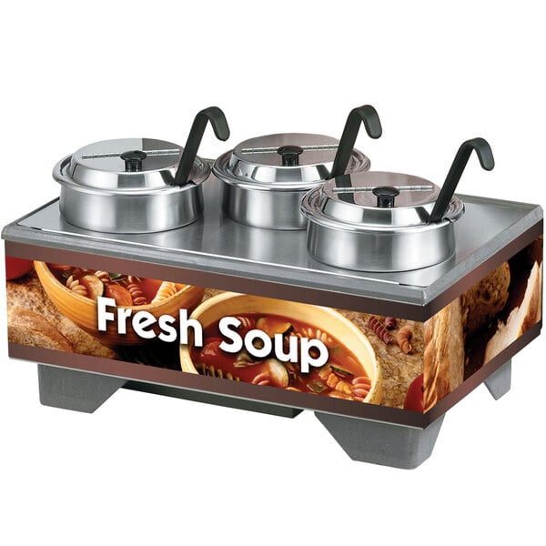 A Vollrath countertop soup warmer with two bowls of soup and lids.