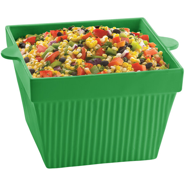 A Tablecraft green square cast aluminum bowl with a mix of vegetables.