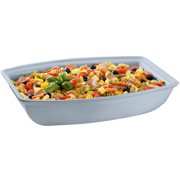 A Tablecraft gray cast aluminum oblong salad bowl filled with pasta salad.