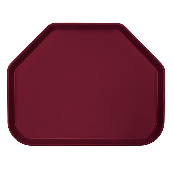 A red trapezoid-shaped Cambro tray on a table.