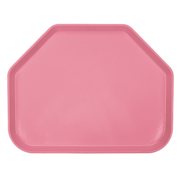 A pink trapezoid shaped Cambro tray with a white background.