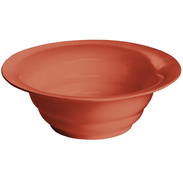 A Tablecraft copper cast aluminum salad bowl with a red rim.
