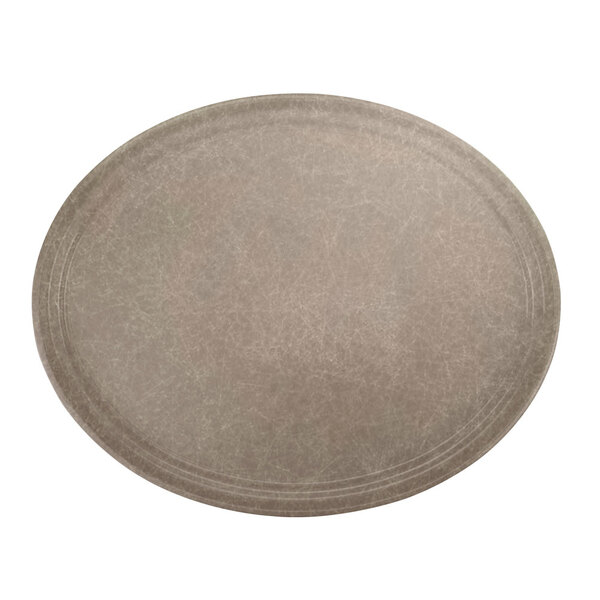 A round brown Cambro fiberglass tray with an oval shape.