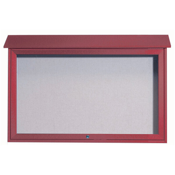 A red framed notice board with a white vinyl tackboard inside.