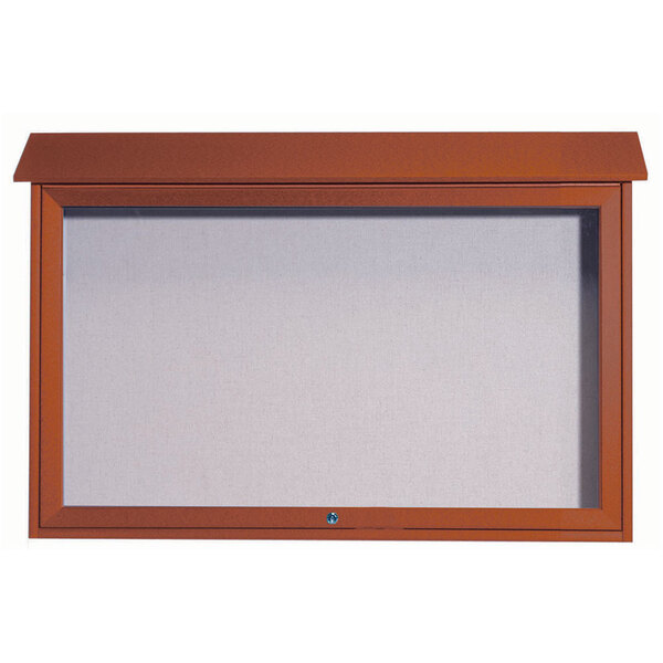 A brown framed notice board with a white vinyl tackboard inside.