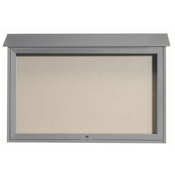 A light gray enclosed bulletin board with a white vinyl tackboard surface.