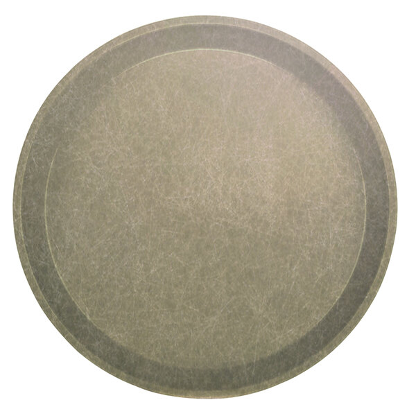 A close-up of a round Cambro fiberglass tray with a brown surface.
