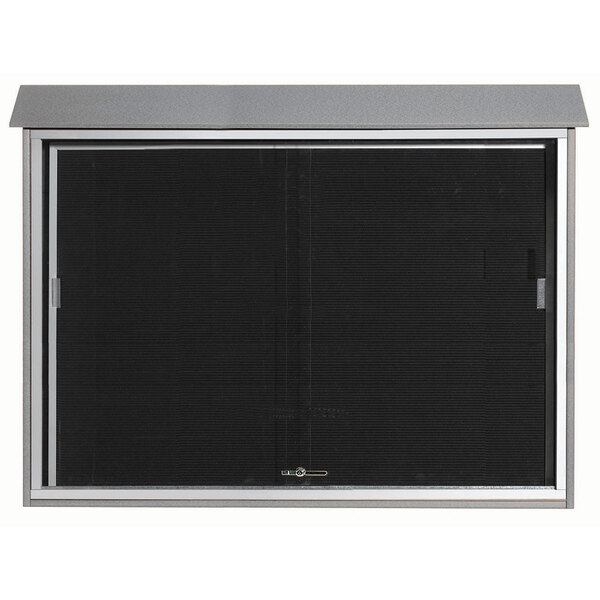 A black metal door with a glass window and black border.