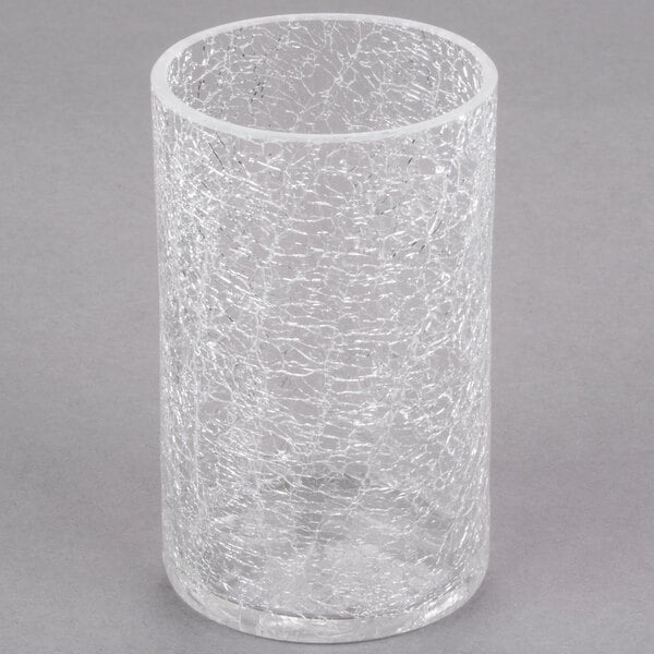 A Sterno clear crackle glass liquid candle holder with a crackle pattern.