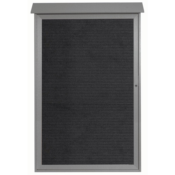 A light gray Aarco outdoor bulletin board with a black letter board inside.