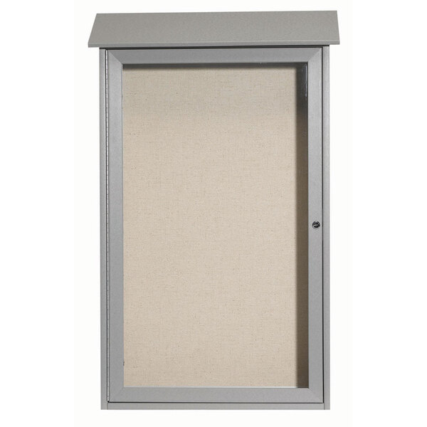 A light gray plastic lumber message board with a vinyl tackboard inside a cabinet with a hinged door.
