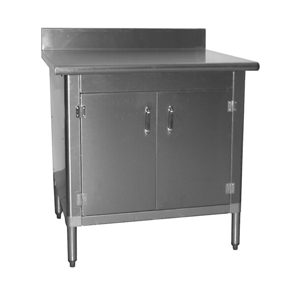 A stainless steel Eagle Group work table with sliding doors.