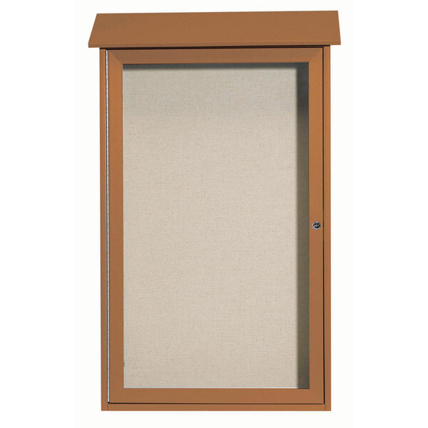 A brown rectangular bulletin board with a white vinyl tackboard behind a brown door.