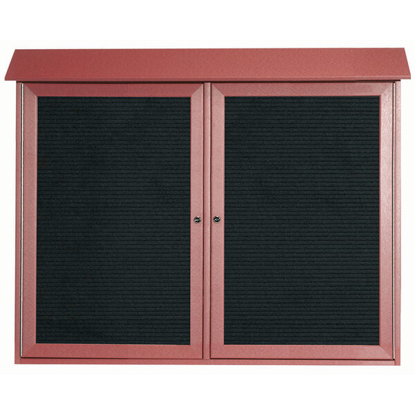 A red enclosed Aarco letter board cabinet with black letter boards.