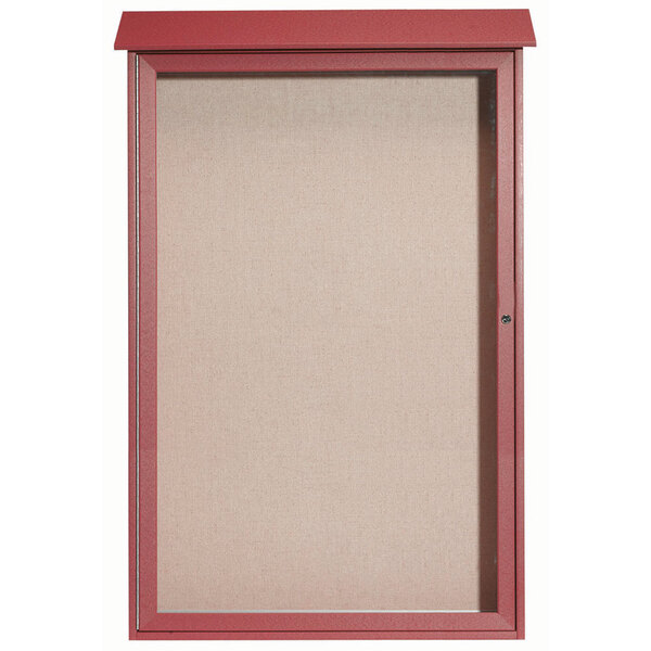 A red enclosed Aarco outdoor bulletin board with a vinyl tackboard and a glass door.