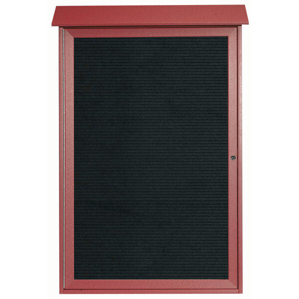 A rosewood outdoor bulletin board with a black board and red frame.