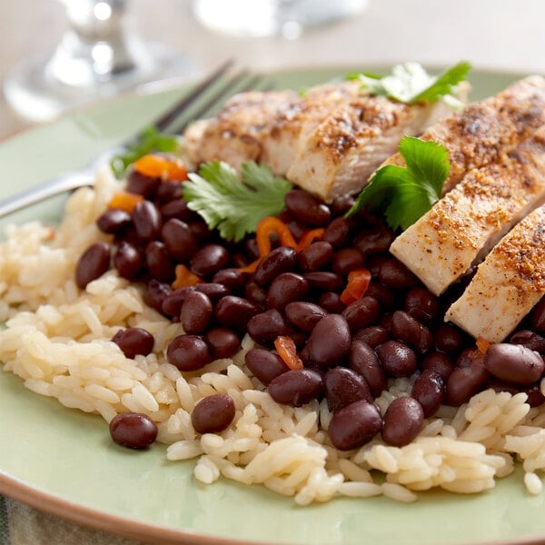 A plate of rice with Furmano's Seasoned Black Beans.