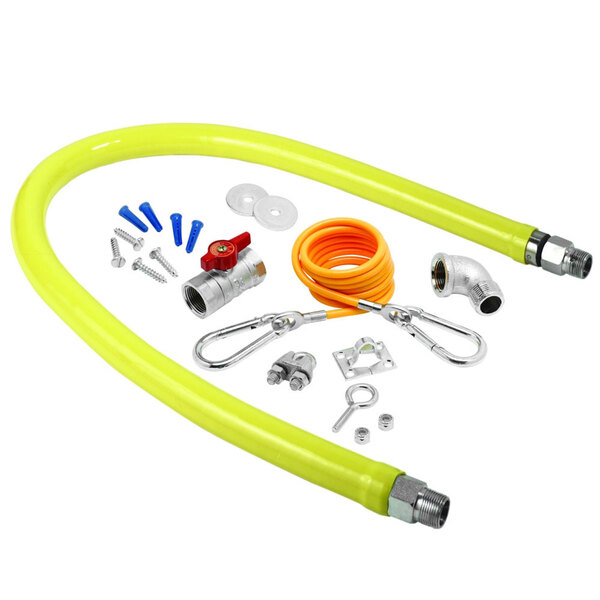 A yellow T&S gas connector hose with various tools and accessories.