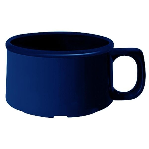 A close-up of a cobalt blue melamine mug with a handle.