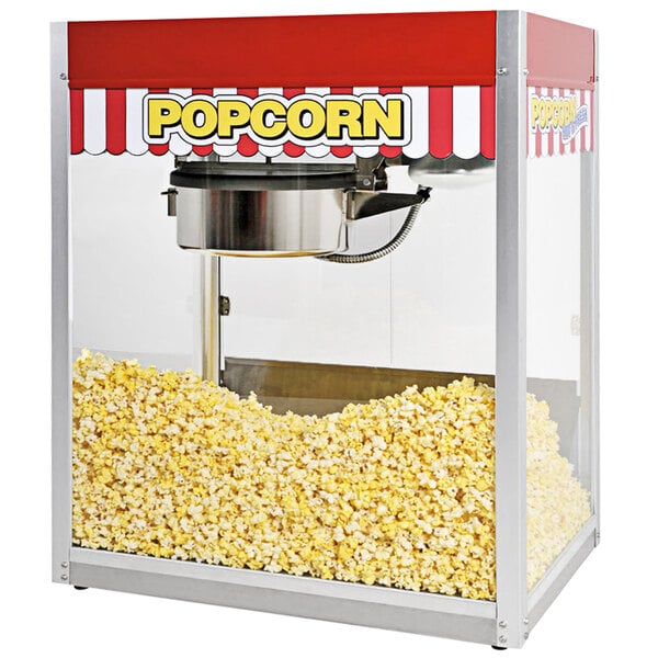 A Paragon Classic Pop popcorn machine with a red and white striped awning.