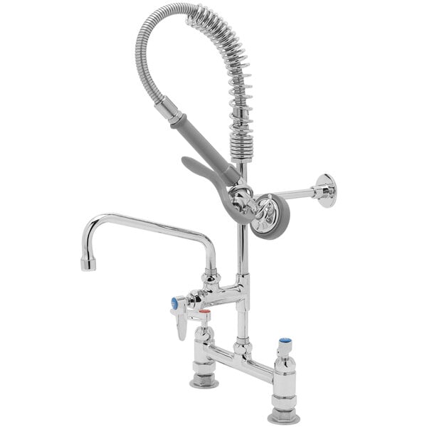 A chrome T&S pre-rinse faucet with hose and sprayer.
