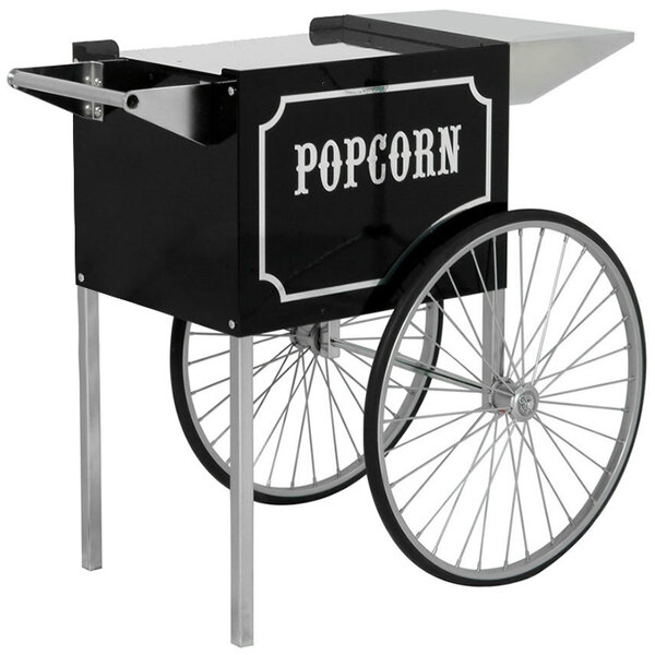 A black and silver Paragon popcorn cart on a table with silver wheels.