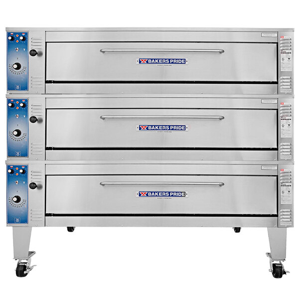 A stack of silver Bakers Pride triple deck pizza ovens.