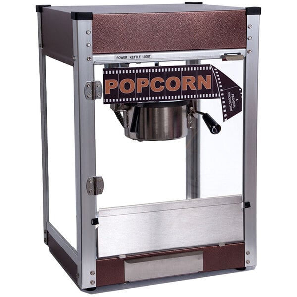 An antique copper and silver Paragon popcorn machine with a film strip on the side.