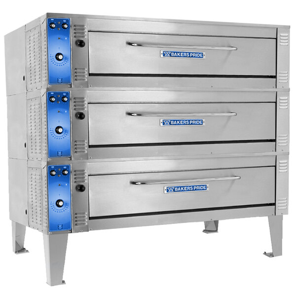 A stack of silver Bakers Pride triple deck electric roast/bake ovens.