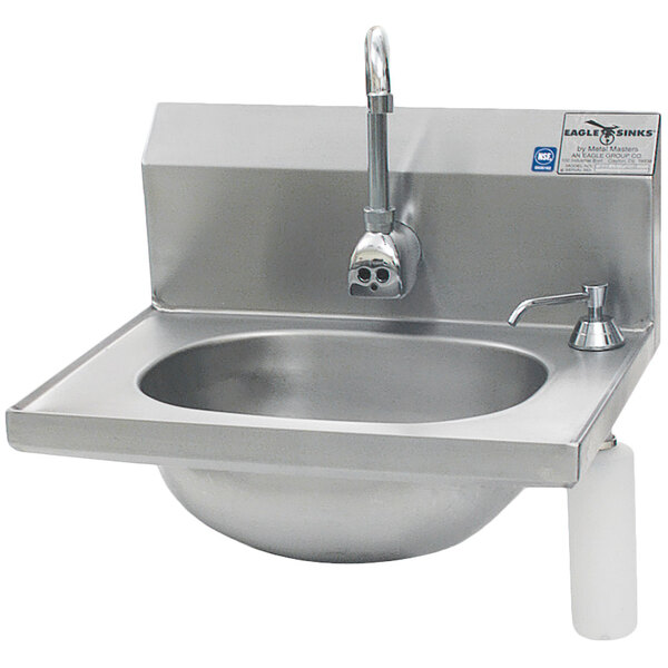 An Eagle Group stainless steel hand sink with a faucet and soap dispenser.