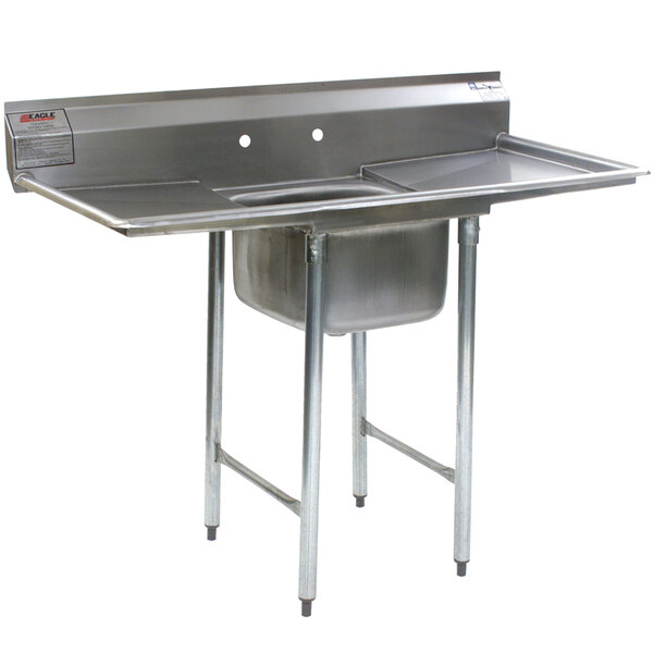 A close-up of an Eagle Group stainless steel commercial compartment sink with two drainboards.