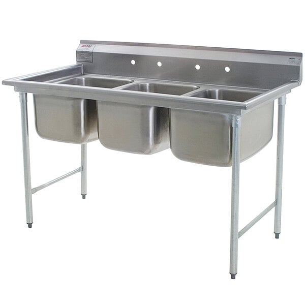 A stainless steel Eagle Group three compartment sink on a counter.