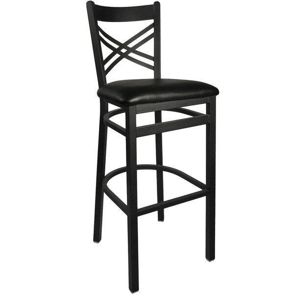 A black BFM Seating metal barstool with a black vinyl seat.