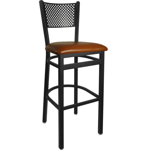 A BFM Seating black steel restaurant bar stool with a light brown vinyl seat.