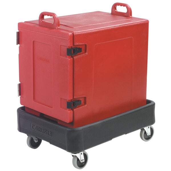 A red Carlisle insulated food pan carrier on a black dolly.