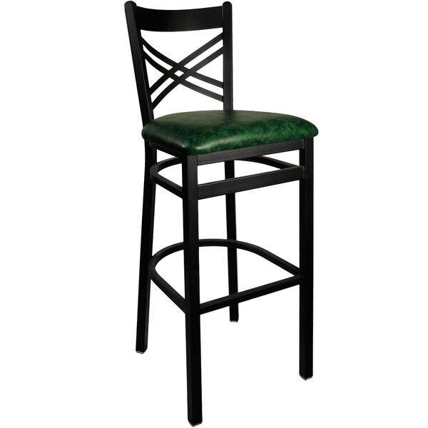 A black metal BFM Seating barstool with a green vinyl seat.
