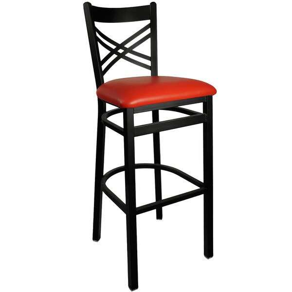A black metal BFM Seating barstool with a red vinyl seat.